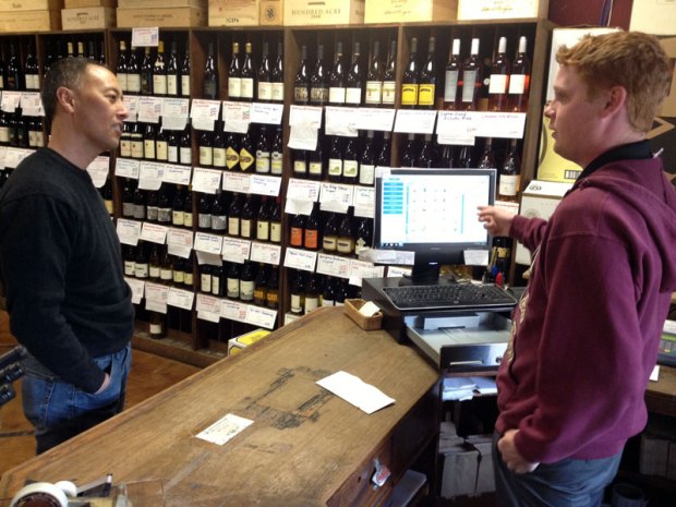 Kato traditionally has staffed his wine shop with Fresno State enology students, including senior Kerry Fitzgerald, right.