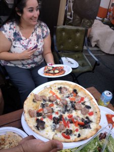 Pizza The sausage pizza has tomatos, Tuscan pork sausage, mixed mushrooms on an alfredo base.